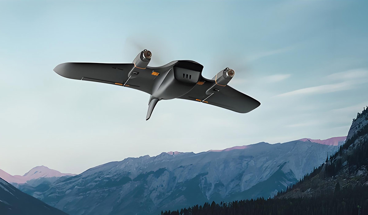 A 2-engine fixed-wing drone flying in the mountains